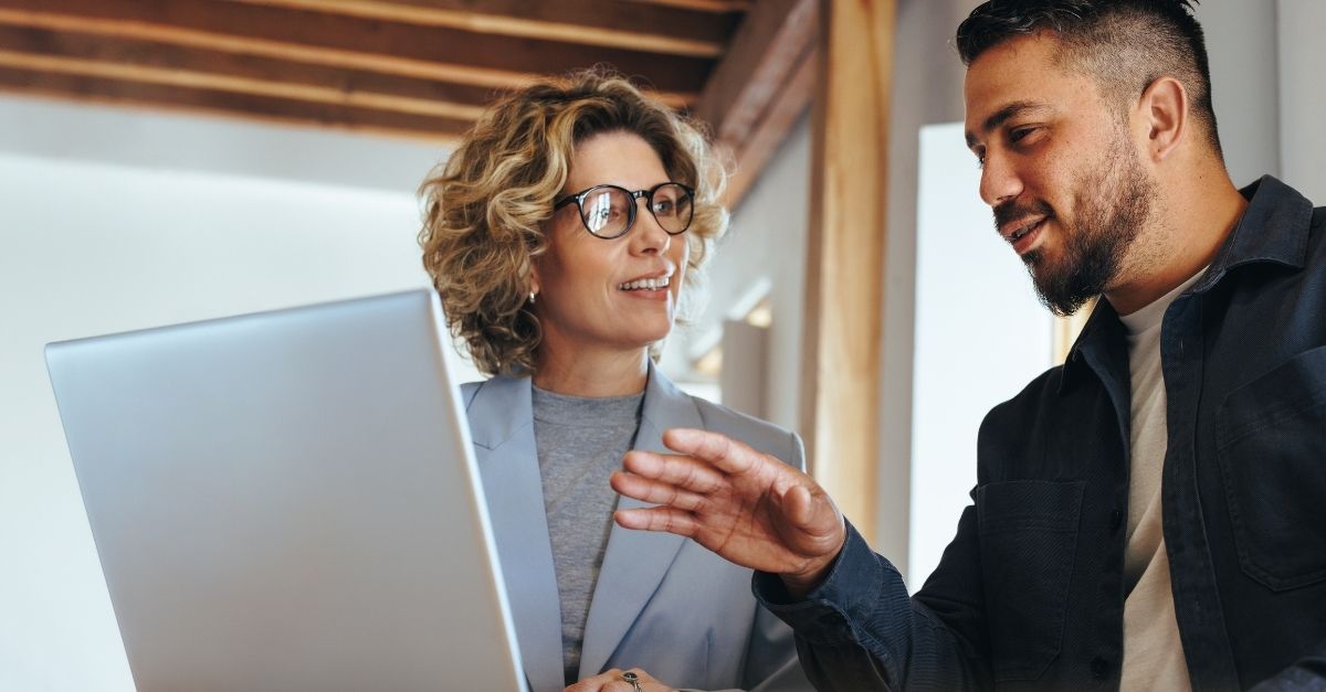 Professionals working together with a laptop